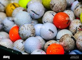 "some used golf balls"